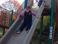 Child Sliding down a slide